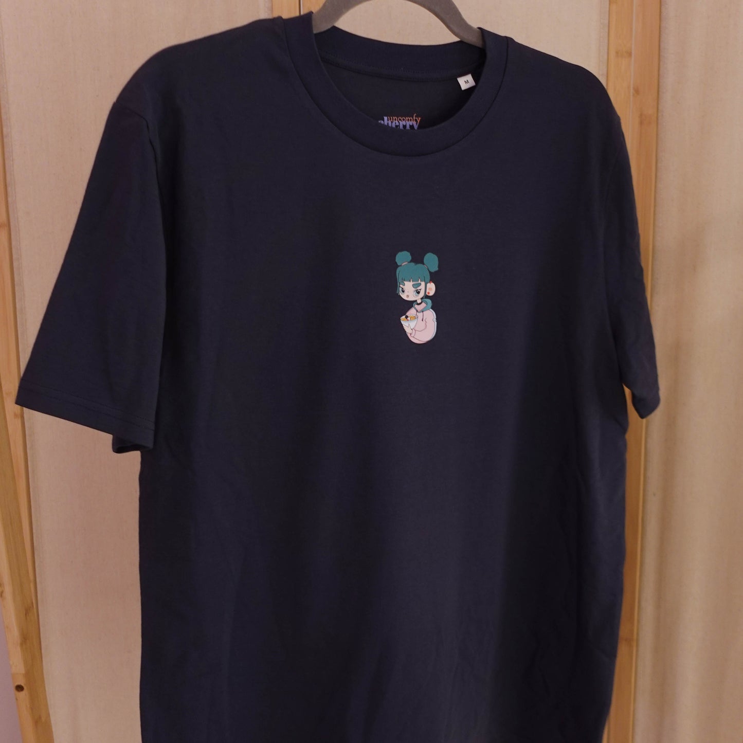 Organic cotton navy black graphic T-shirt featuring the original Ramen Girl illustration.